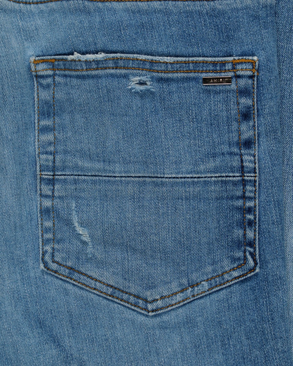 Amiri knee-ripped blue skinny jeans thumbnail